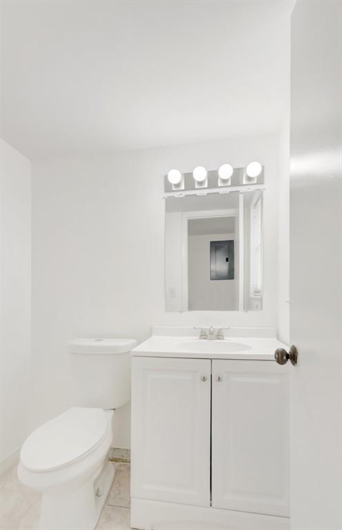 5501 Northwest 2nd Avenue, Unit 302 Boca Raton, FL 33487 - Photo 20 of 26 a bathroom with a toilet sink and mirror