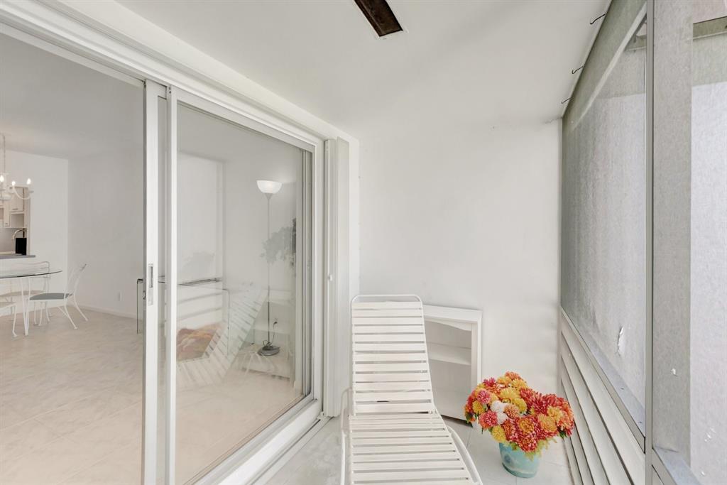 5501 Northwest 2nd Avenue, Unit 302 Boca Raton, FL 33487 - Photo 21 of 26 a bathroom with a tub and shower