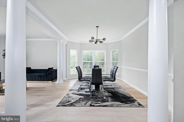 a view of entryway with wooden floor and stairs