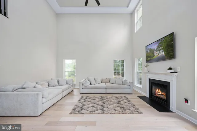 a large bathroom with a double vanity sink a mirror and a bathtub