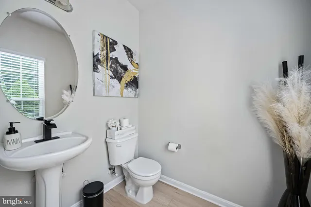 an aerial view of a house with a yard and lake view