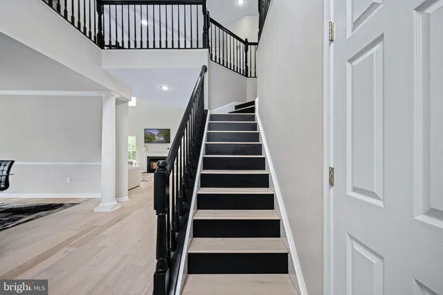 a view of a house with a yard and deck