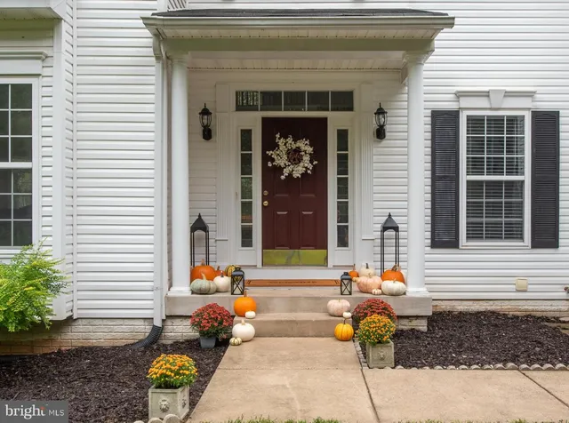 a kitchen with stainless steel appliances granite countertop a sink a stove and cabinets