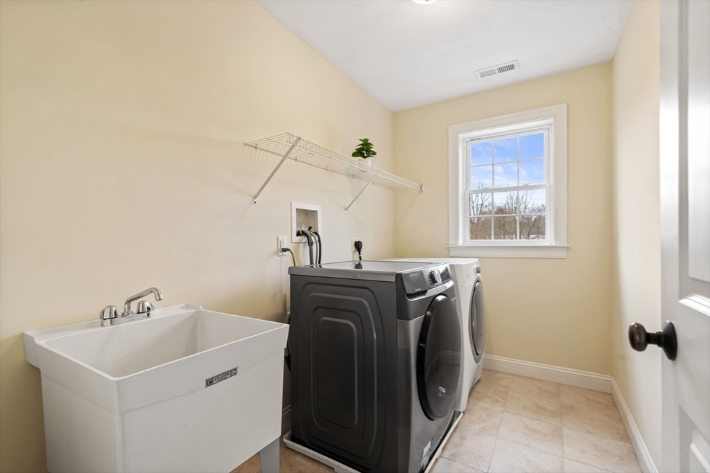 30 Neponset Street Walpole, MA 02071 - Photo 30 of 41 a utility room with dryer and washer