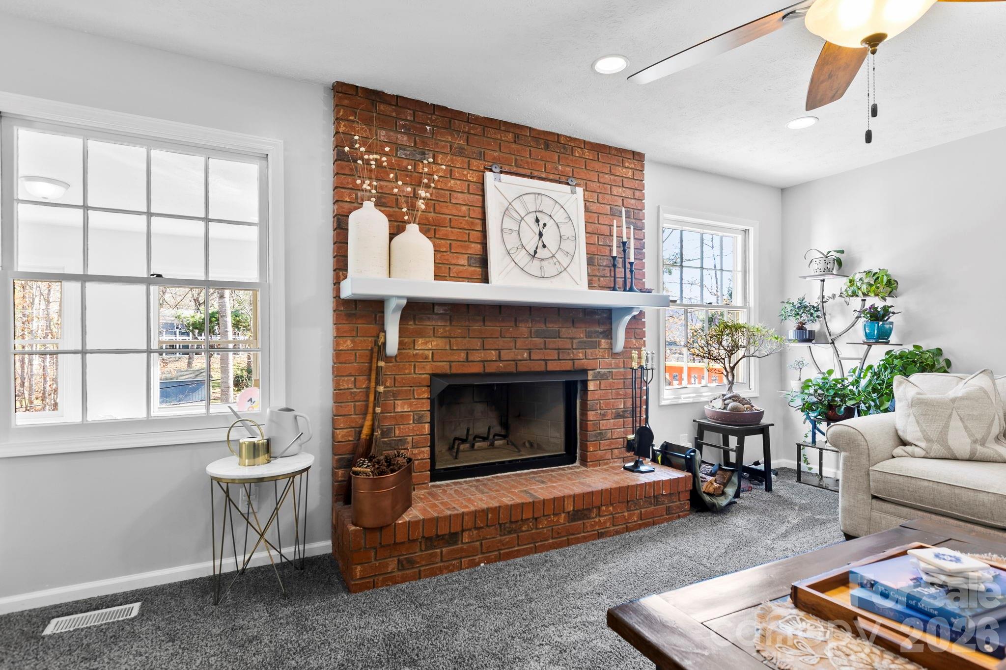 15 Blueberry Hill Road Asheville, NC 28804 - Photo 13 of 35 a living room with furniture and a fireplace