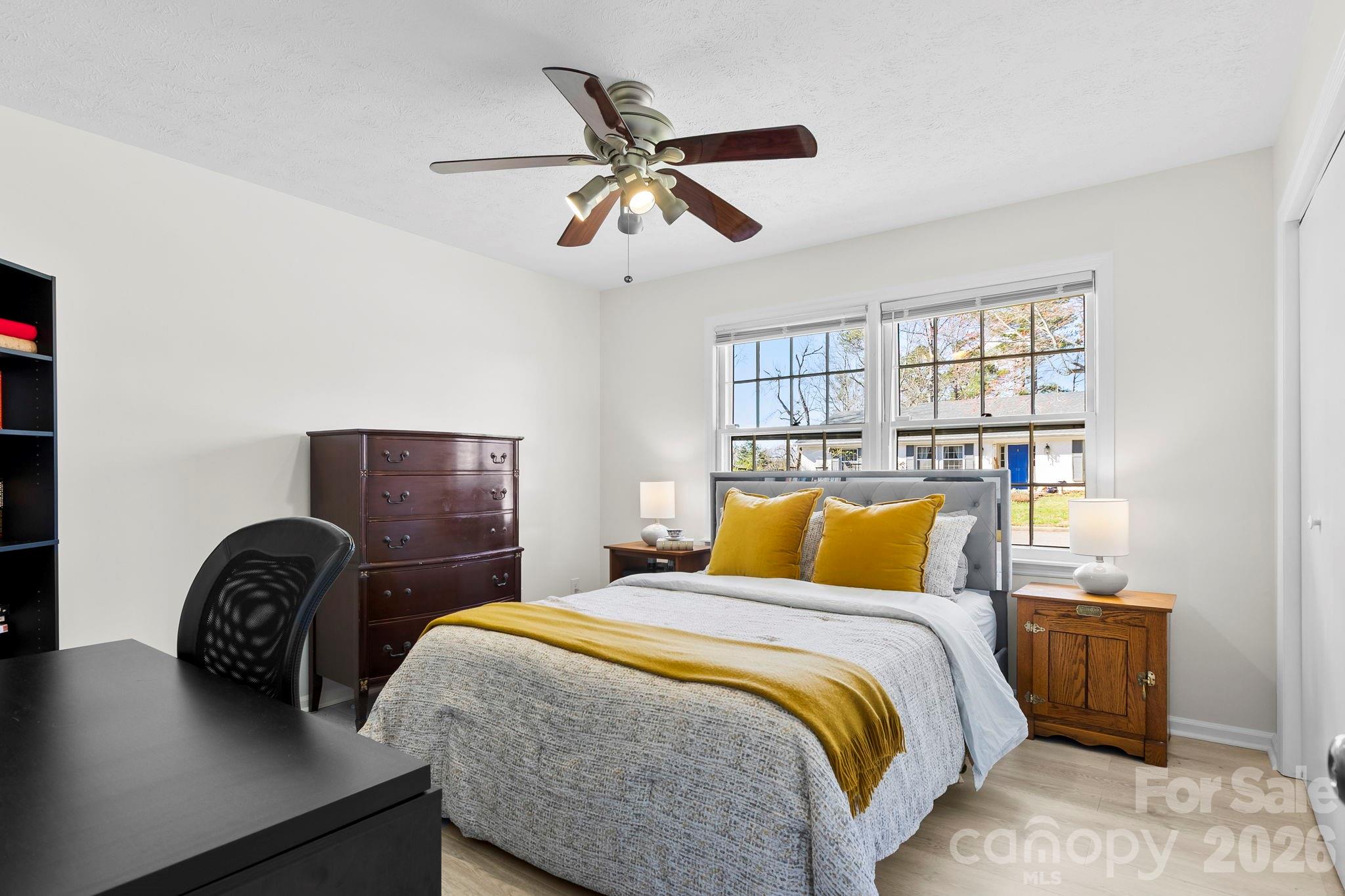 15 Blueberry Hill Road Asheville, NC 28804 - Photo 16 of 35 a bedroom with a bed and dresser