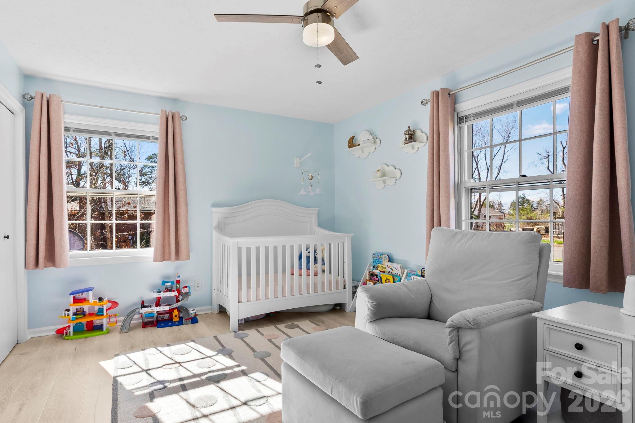 15 Blueberry Hill Road Asheville, NC 28804 - Photo 17 of 35 a bedroom with furniture and a window