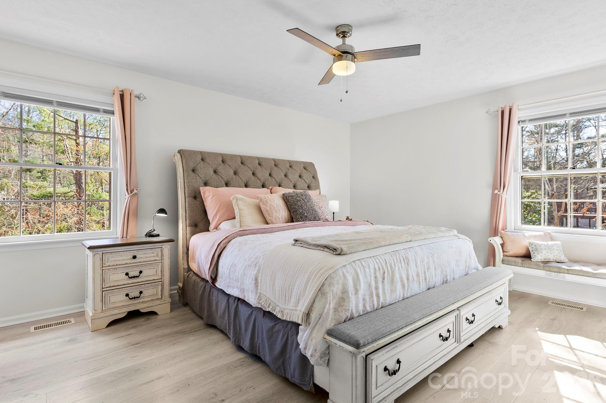 15 Blueberry Hill Road Asheville, NC 28804 - Photo 19 of 35 a spacious bedroom with a bed and a window