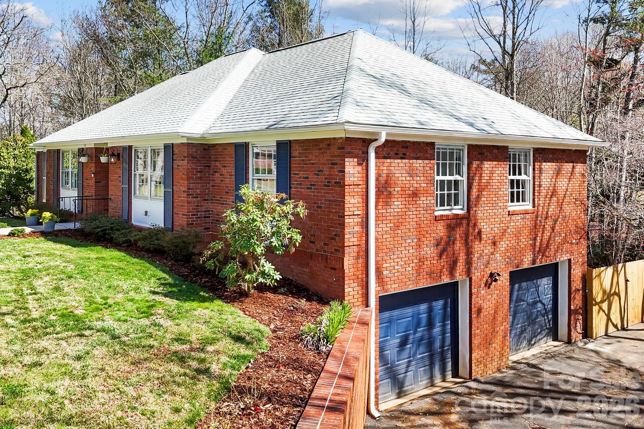 15 Blueberry Hill Road Asheville, NC 28804 - Photo 2 of 35 a front view of a house with garden