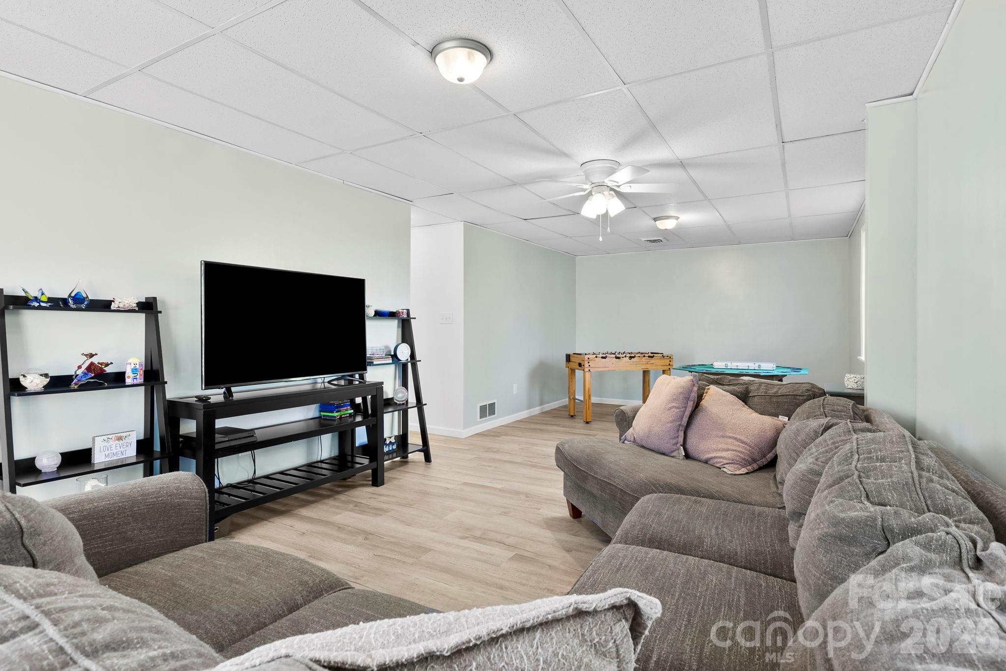 15 Blueberry Hill Road Asheville, NC 28804 - Photo 22 of 35 a living room with furniture and a flat screen tv