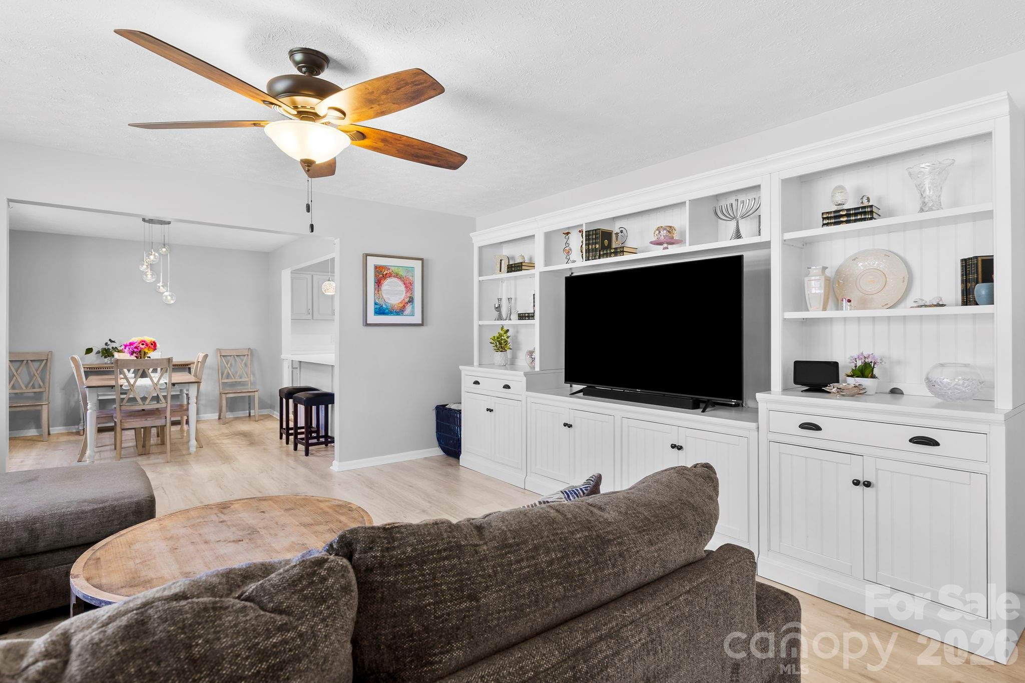 15 Blueberry Hill Road Asheville, NC 28804 - Photo 3 of 35 a living room with furniture and a flat screen tv