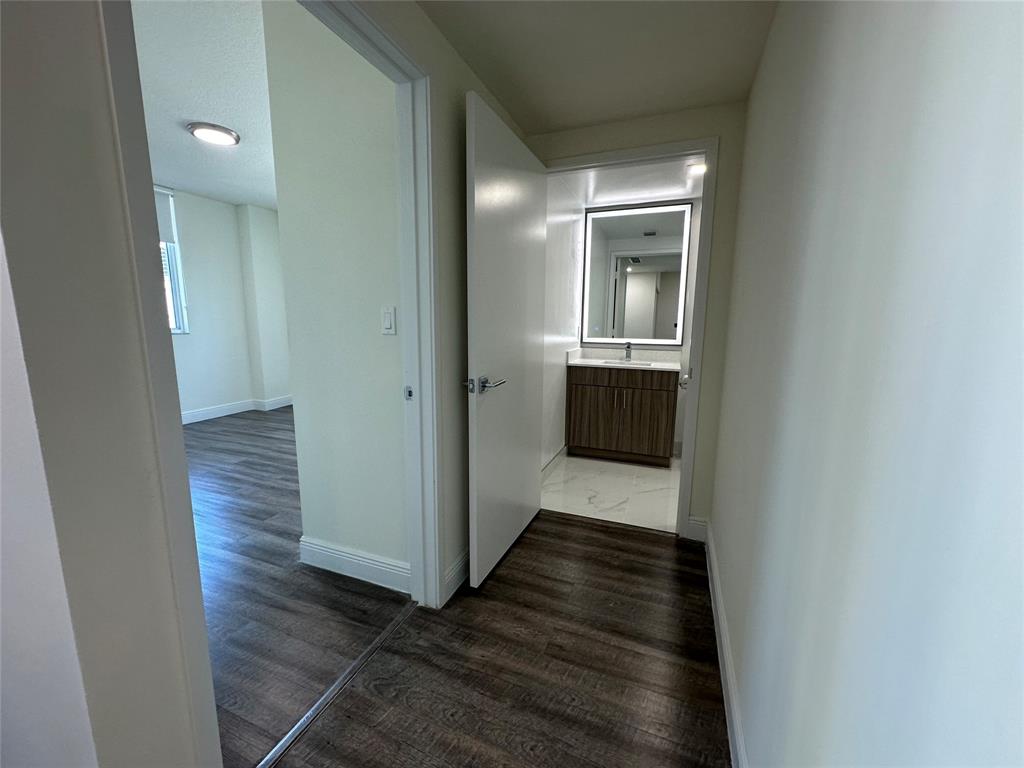 110 Southwest 12th Street, Unit 902 Miami, FL 33130 - Photo 13 of 25 a view of hallway with wooden floor
