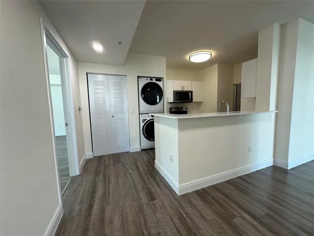 a view of kitchen with wooden floor