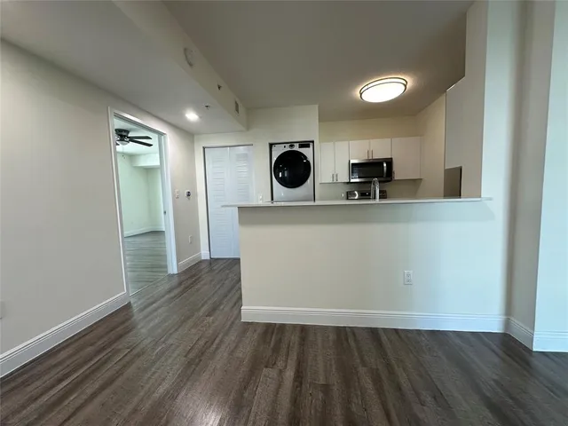 a view of kitchen with wooden floor