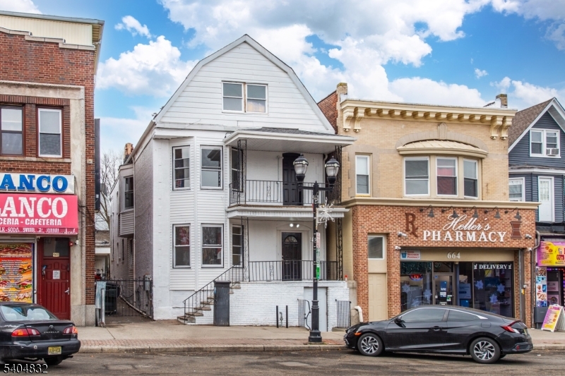 662 Mt Prospect Avenue Newark, NJ 07104 - Photo 2 of 15 a car parked in front of a building