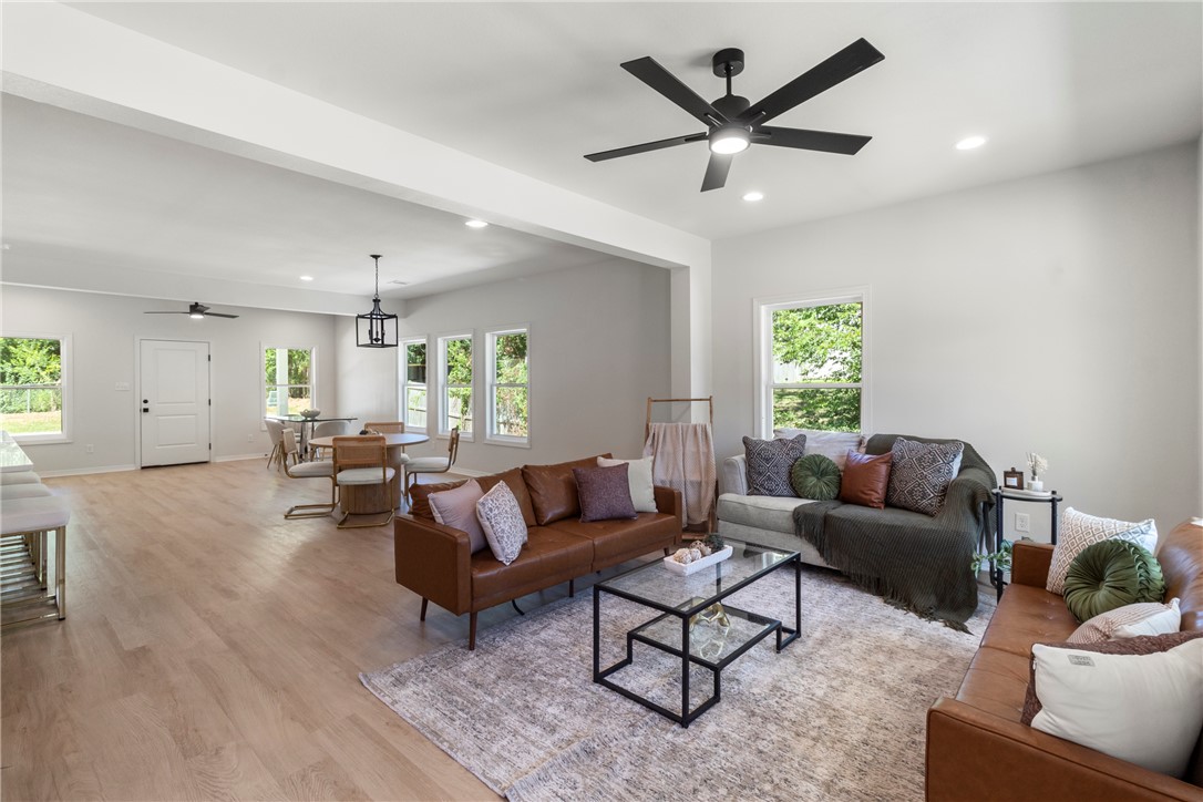 1104 Berkeley Street College Station, TX 77840 - Photo 16 of 44 a living room with furniture and a large window with wooden floor