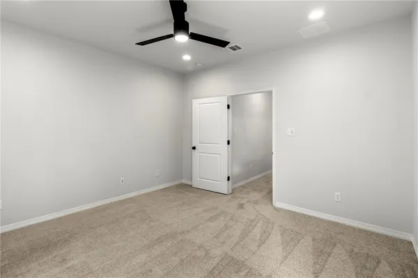 an empty room with fan