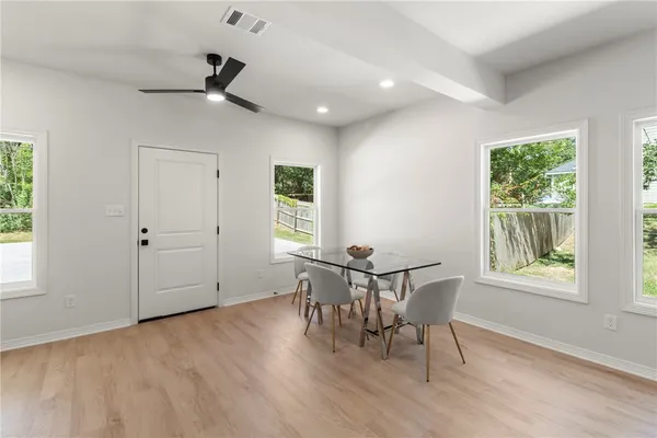 a view of a room with furniture window and wooden floor