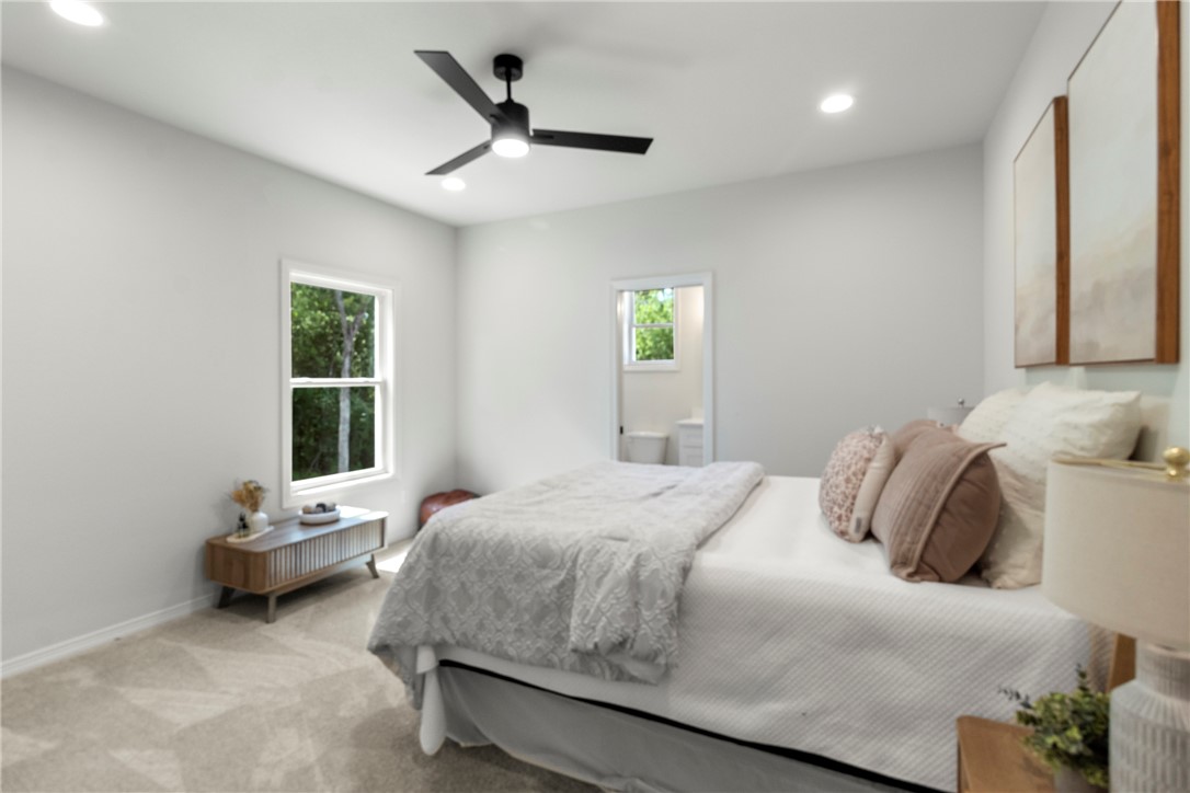 1104 Berkeley Street College Station, TX 77840 - Photo 28 of 44 a bedroom with a bed a window and a couch