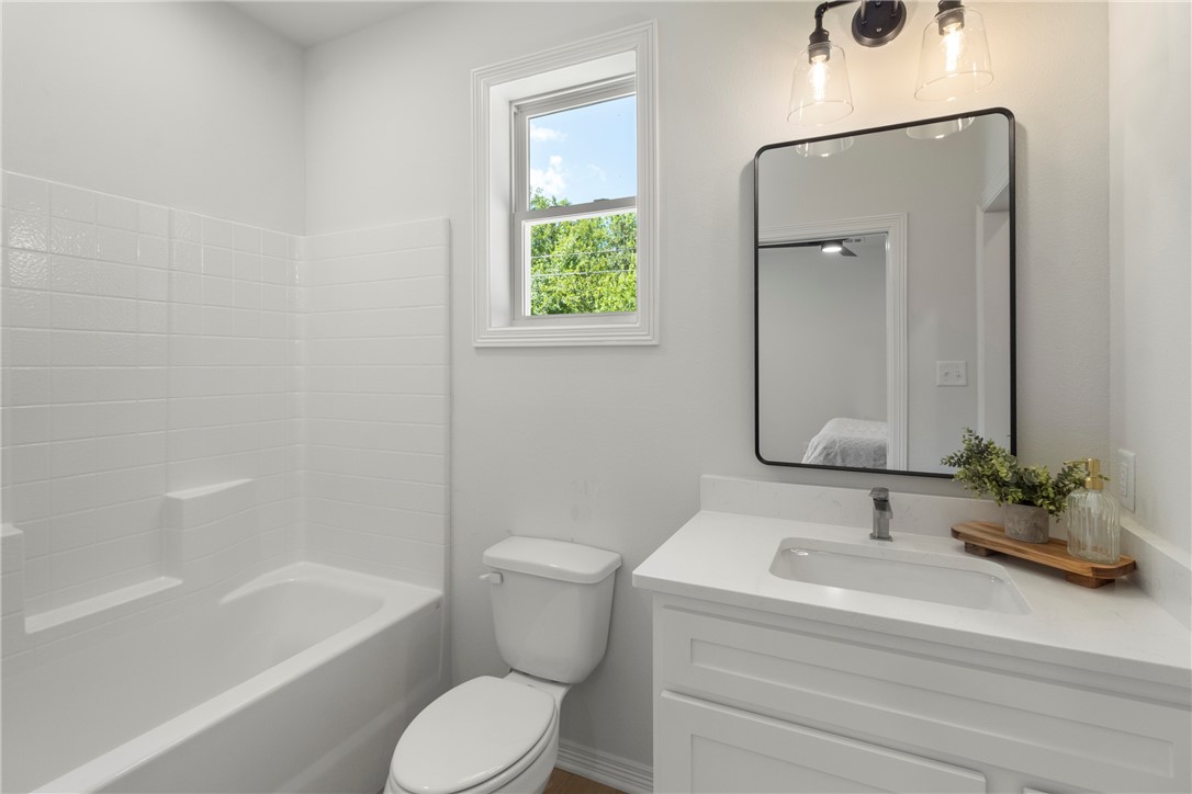 1104 Berkeley Street College Station, TX 77840 - Photo 30 of 44 a bathroom with a sink and a mirror
