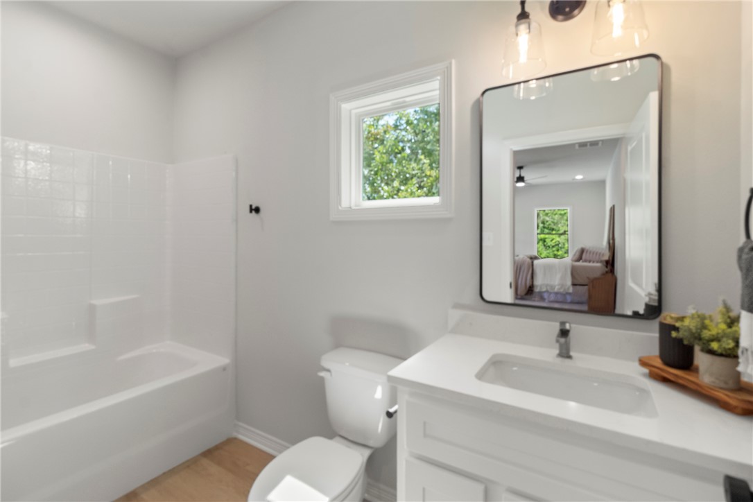 1104 Berkeley Street College Station, TX 77840 - Photo 37 of 44 a bathroom with a sink toilet and bathtub
