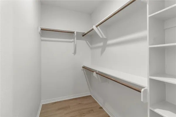 a view of an empty walk in closet
