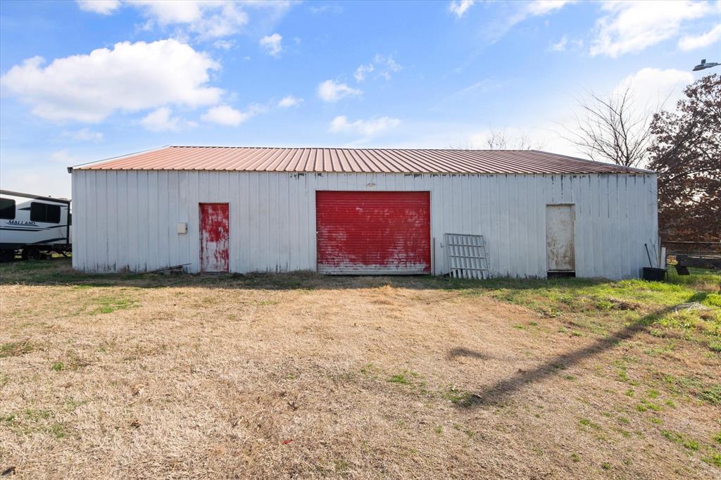 443 County Road 3799 Springtown, TX 76082 - Photo 29 of 33 View of shop/barn with a yard