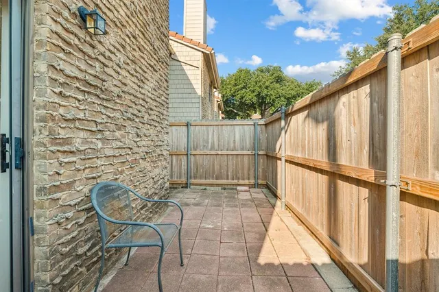 a view of entryway with wooden floor and seating space
