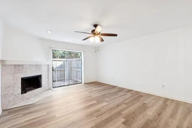 a view of empty room with fireplace