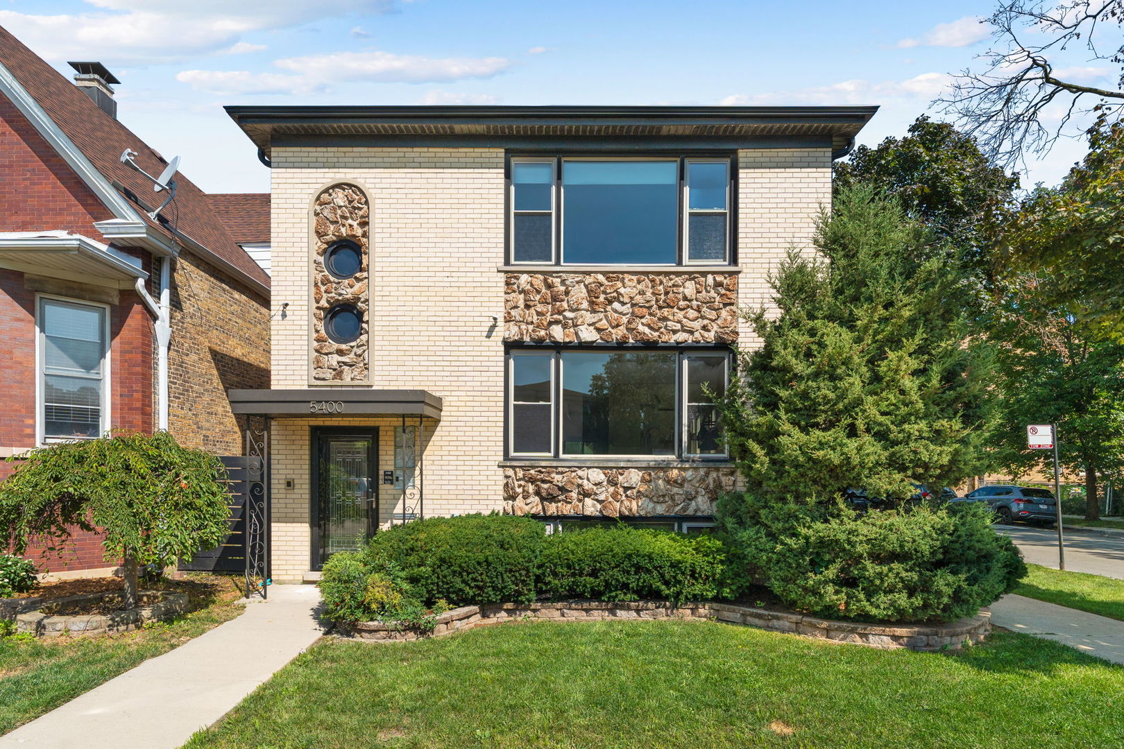 5400 West Dakin Street, Unit 1 Chicago, IL 60641 - Photo 1 of 20 front view of a house with a yard