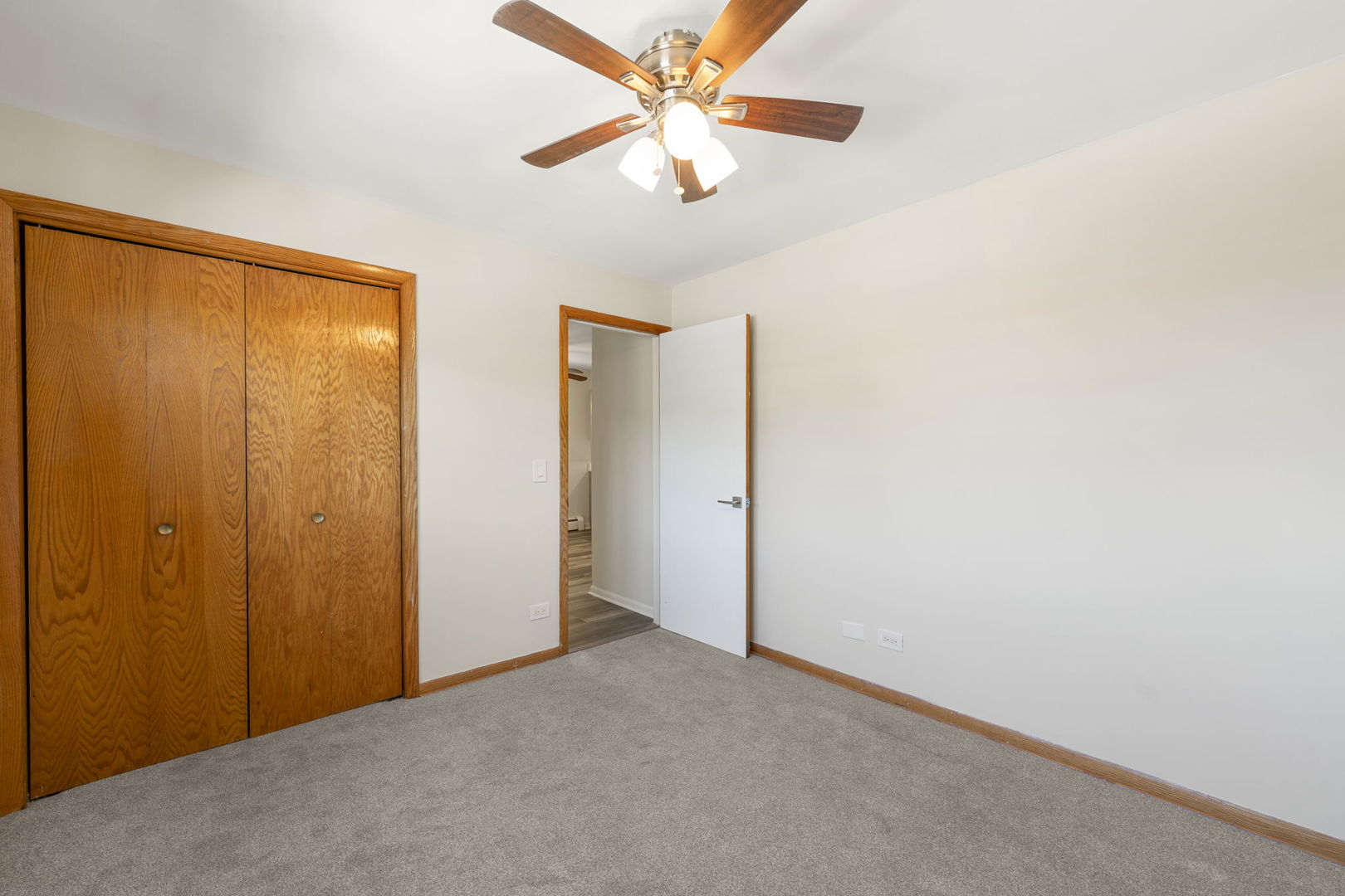 5400 West Dakin Street, Unit 1 Chicago, IL 60641 - Photo 20 of 20 an empty room with closet and a ceiling fan