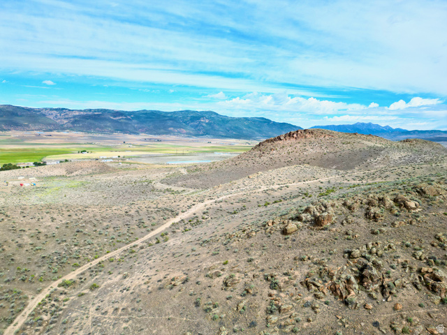 600 East E Street Moroni, UT 84646 - Photo 15 of 38 Expansive land parcel featuring a rugged, elevated terrain and a visible dirt path