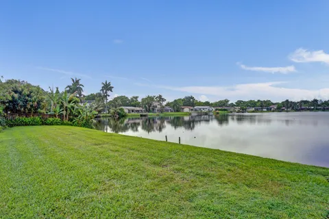 a view of a lake with houses in the back
