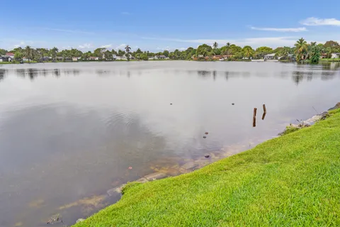 a view of a lake with a big yard
