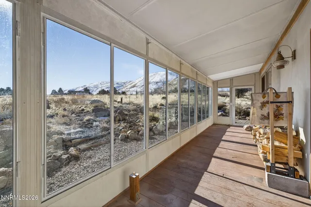 a kitchen with kitchen island granite countertop a sink cabinets and stainless steel appliances