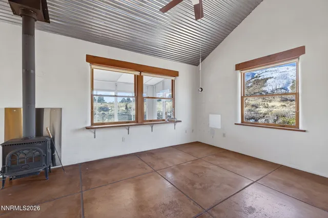 a view of a house with backyard and a garage