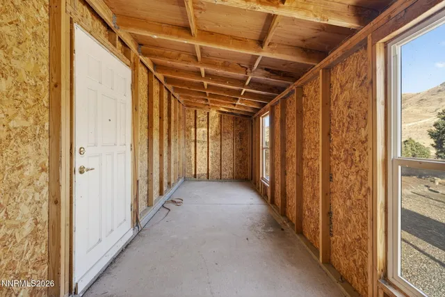 a house with a mountain in the background