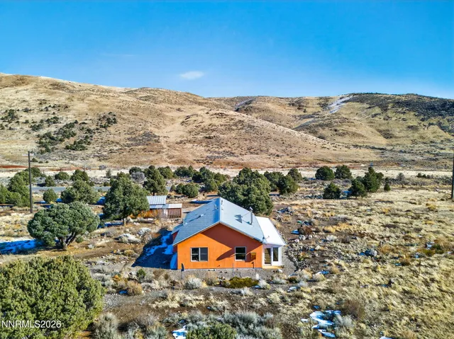 a view of a house with a mountain