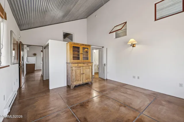 a view of a hallway with a kitchen