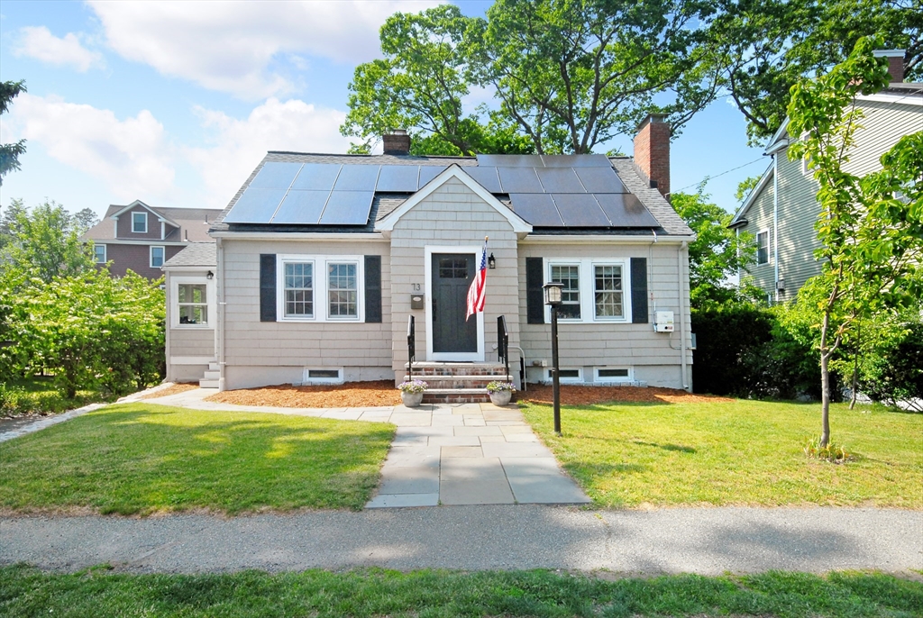 73 Grandview Road Arlington, MA 02476 - Photo 1 of 41 a view of a house with a swimming pool and a yard