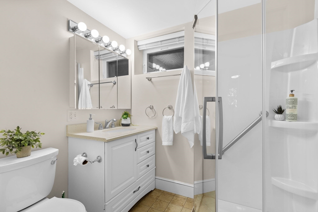 73 Grandview Road Arlington, MA 02476 - Photo 36 of 41 a bathroom with a sink a toilet and shower