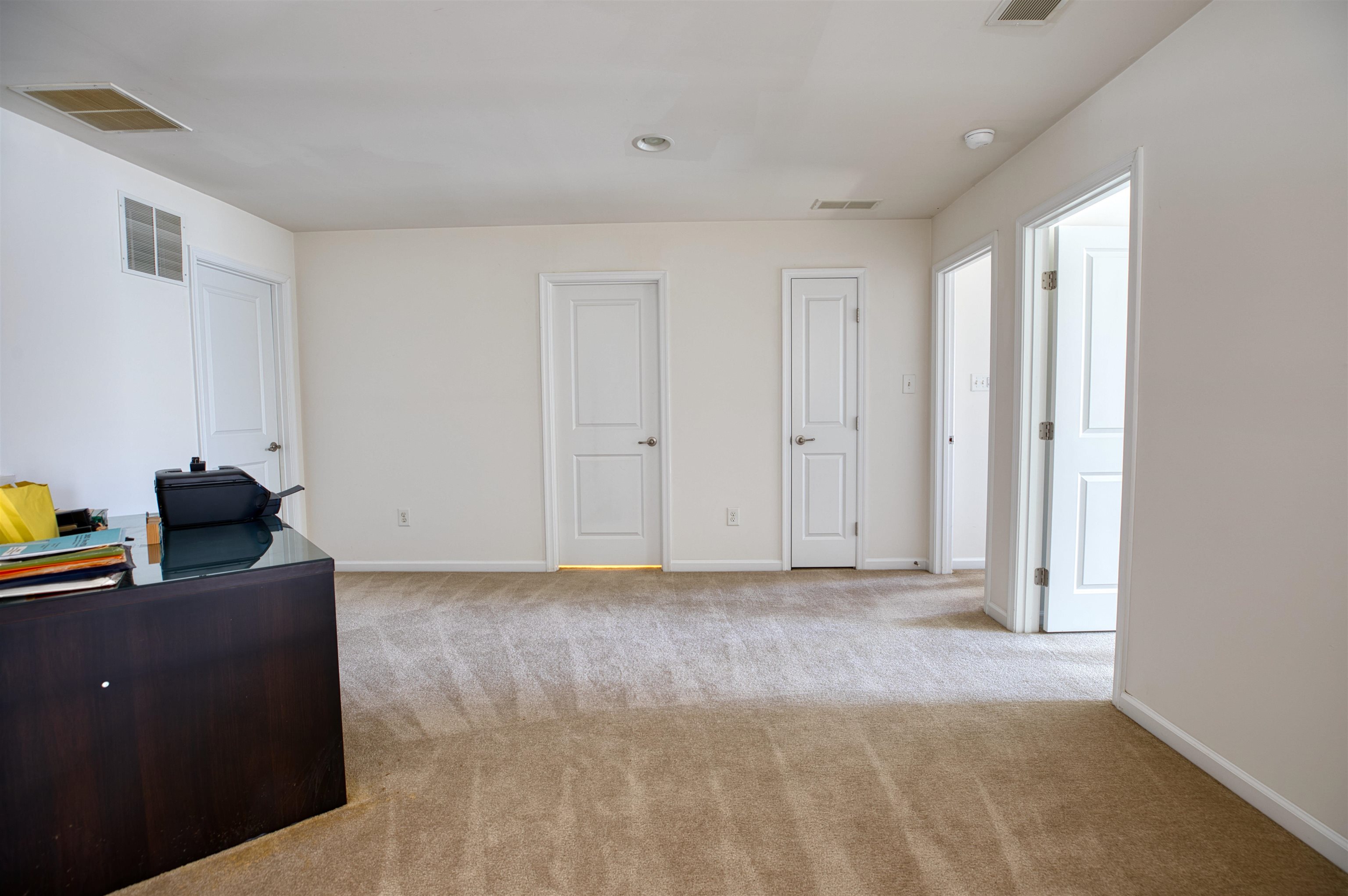 2305 Tidewater Avenue, Unit 2305 Rio Grande, NJ 08242 - Photo 14 of 23 a view of a room with wooden floor and cabinet