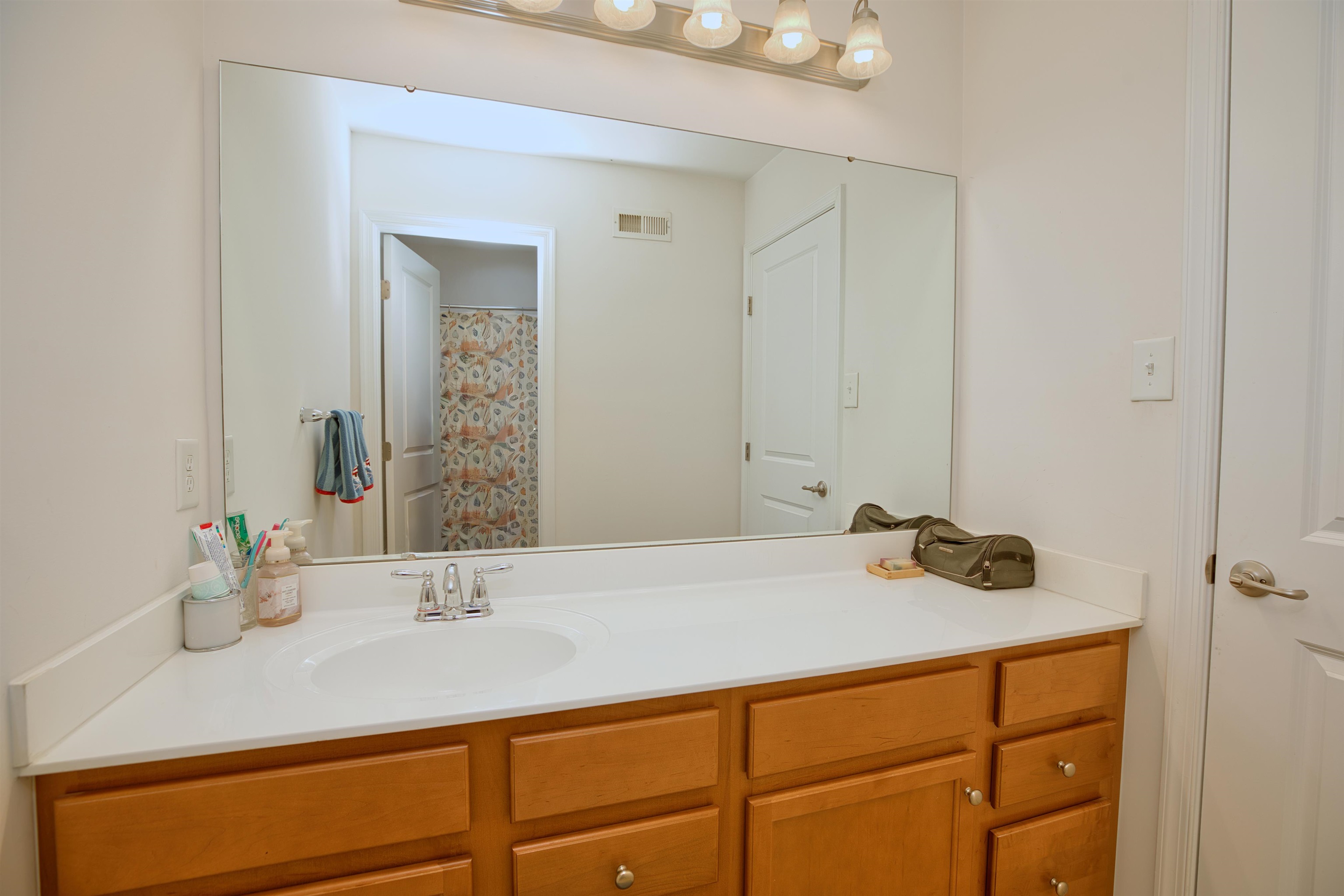 2305 Tidewater Avenue, Unit 2305 Rio Grande, NJ 08242 - Photo 16 of 23 a bathroom with a sink and a mirror