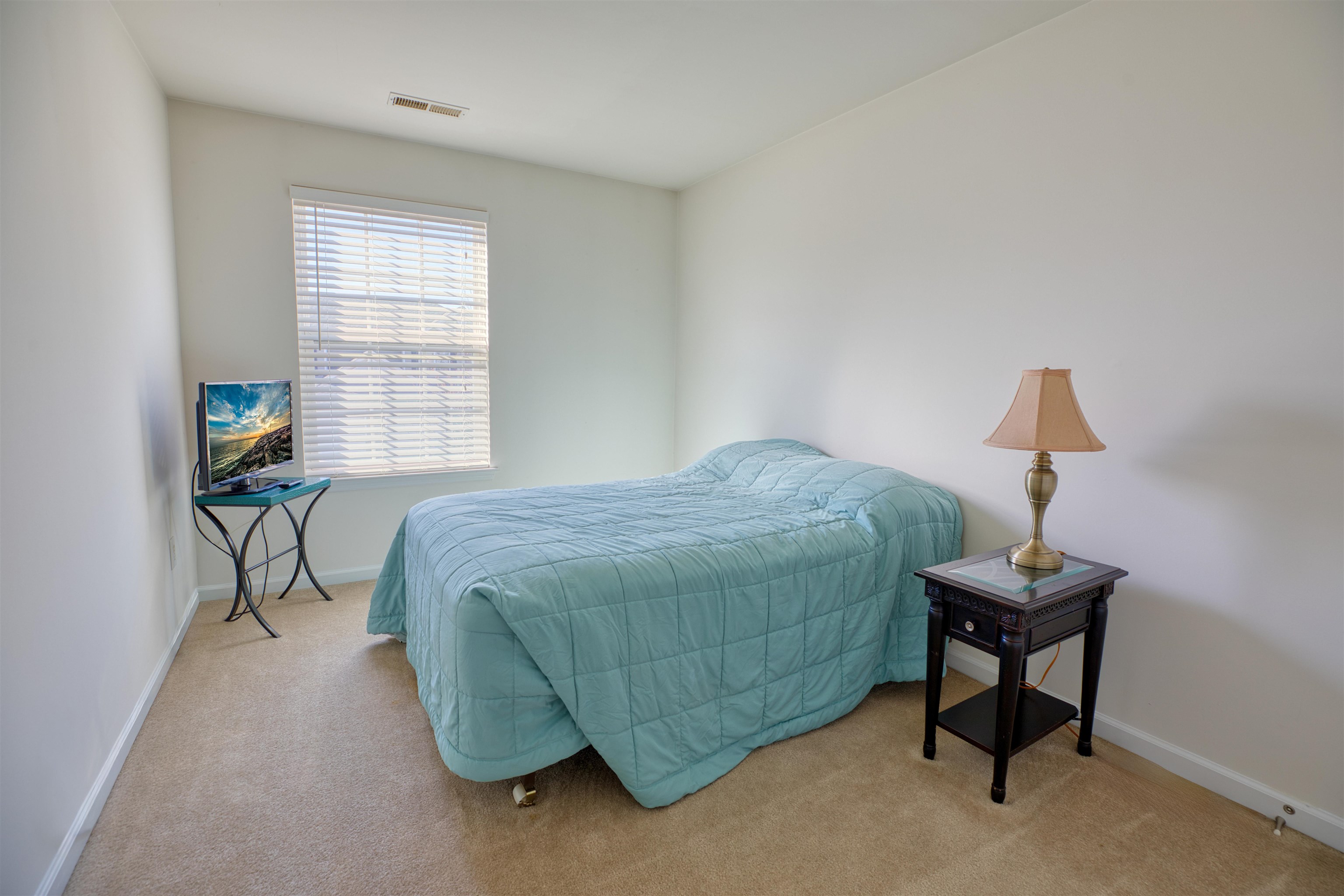 2305 Tidewater Avenue, Unit 2305 Rio Grande, NJ 08242 - Photo 18 of 23 a bedroom with a bed and a window