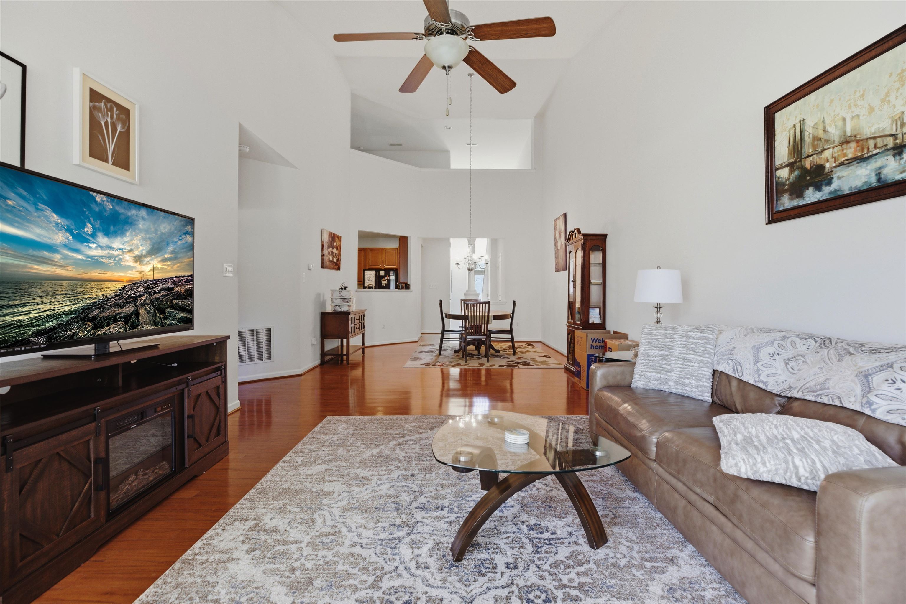2305 Tidewater Avenue, Unit 2305 Rio Grande, NJ 08242 - Photo 4 of 23 a living room with furniture and a flat screen tv