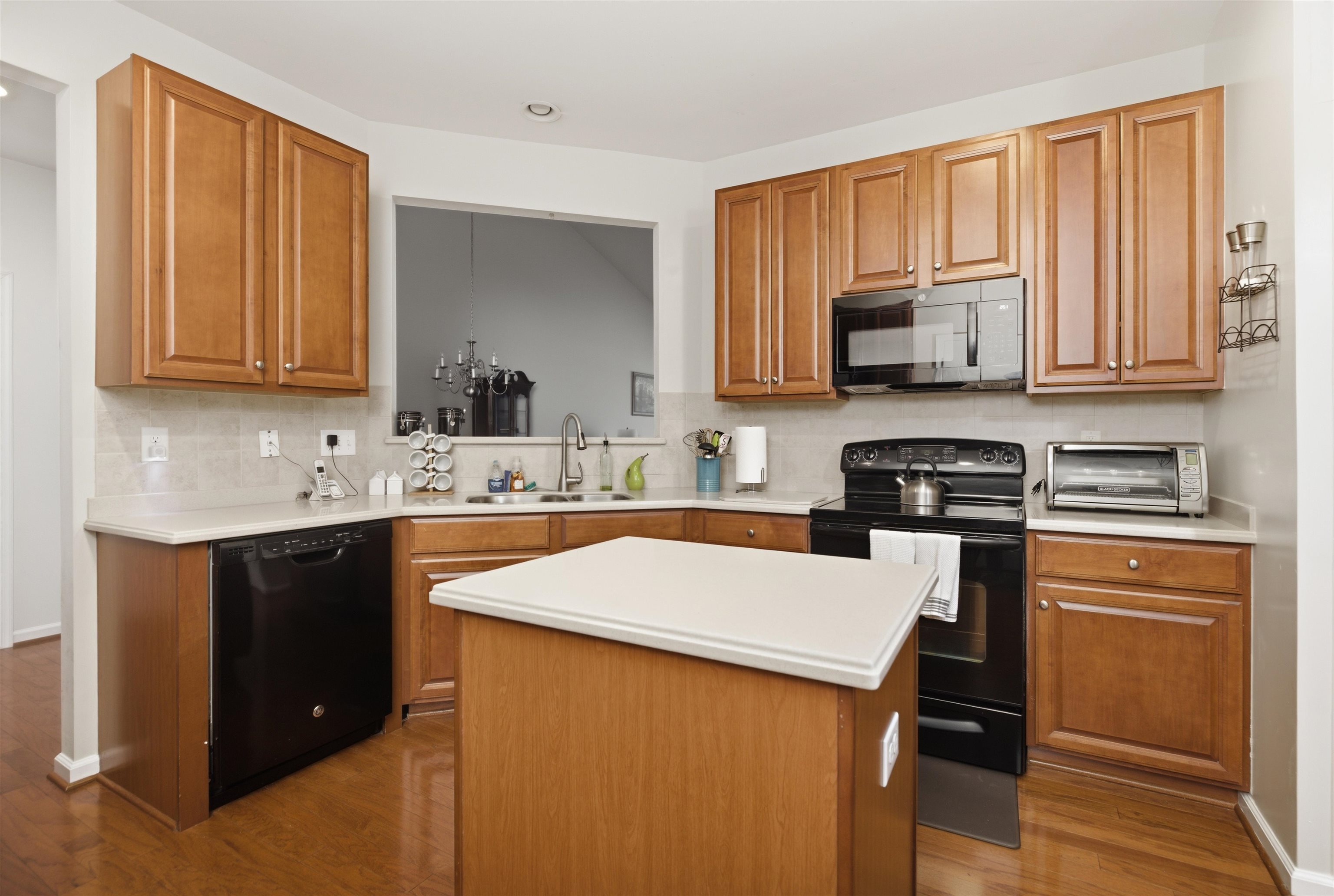 2305 Tidewater Avenue, Unit 2305 Rio Grande, NJ 08242 - Photo 6 of 23 a kitchen with stainless steel appliances white cabinets sink and a microwave