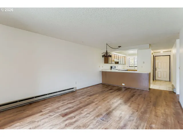 a kitchen with a sink a stove and cabinets
