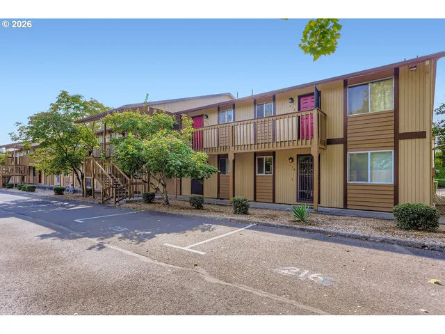 a front view of a building with garden