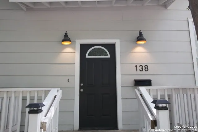 a view of a house with a tree