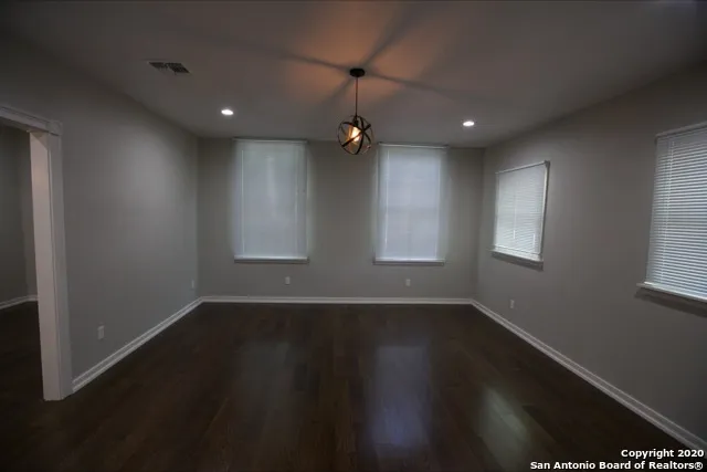 a view of hallway with wooden floor